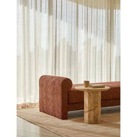 GlobeWest Tepih Curve Rug in dusty rose with subtle geometric pattern and rounded edges in a modern living room setting
