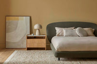 GlobeWest Easton Easton Arch Table Lamp - Birch, styled in a room setting