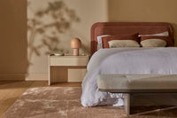 GlobeWest Tepih Curve Rug - Dusty Rose, styled in a room setting