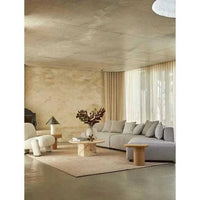 Globe West Seb Pedestal Side Table in natural oak with narrow oval top and cantilever design
