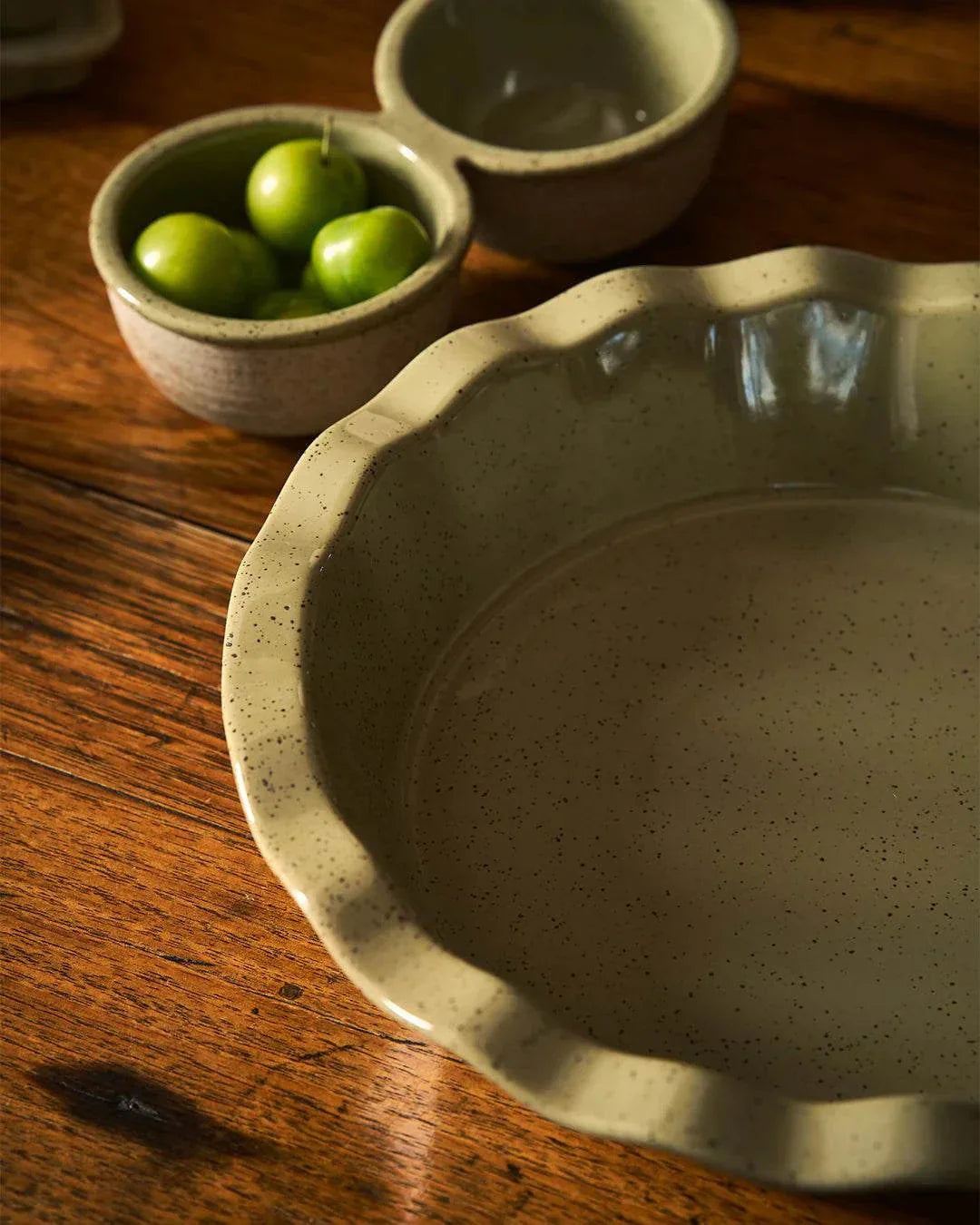 Robert Gordon Kitchen Life stoneware pie dish with green reactive glaze and leaf design