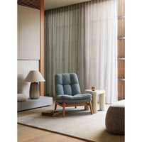 GlobeWest Kip Occasional Chair in Nimbus fabric with natural ash wood legs in a modern living room setting