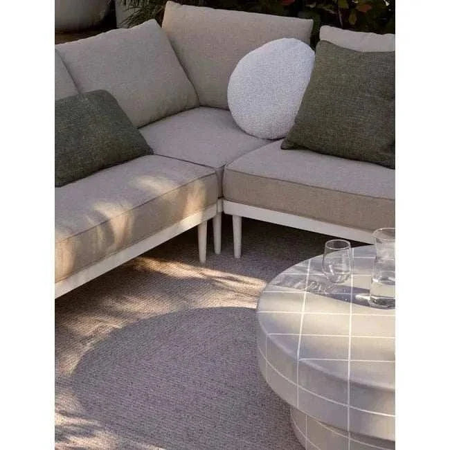 GlobeWest Seville Tile round pearl white coffee table with tiled top in outdoor seating area