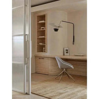 GlobeWest Tepih Neptune Rug in ginger color, hand-woven wool blend area rug in a minimalist room setting