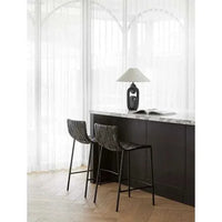 GlobeWest Everly Barstool in linen grey with matte grey iron legs and recycled leather upholstery at kitchen island