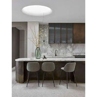 Boden Ridge Vase in marine blue with textured ridged design and glossy finish displayed in modern kitchen setting