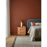 Trove Burl Bedside Table in light burl veneer with brass handles styled in a modern bedroom setting