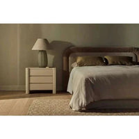 GlobeWest August 3 Drawer Bedside in Snowgum ash veneer next to bed with lamp on top in minimalist bedroom