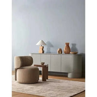 GlobeWest Tepih Neptune Rug in dusty rose wool blend hand-woven on wooden floor in modern minimal living room setting