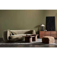 GlobeWest Hugo Vera 4 seater sofa in oat boucle fabric with rounded edges and plush cushioning in a modern living room setting