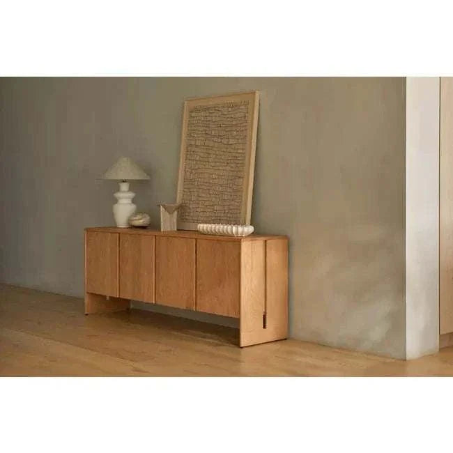 GlobeWest Lorne Bronte table lamp with ceramic mocha brown base and oatmeal fabric shade on wooden sideboard in minimalist room