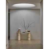 GlobeWest Easton Ellipse Table Lamp - Travertine/Burgundy, styled in a room setting