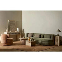 Modern living room featuring the Easton Collins Table Lamp with olive green base and ecru shade on a wooden side table