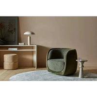 Easton Ellipse Table Lamp with olive green metal shade and travertine marble base in modern living room setting