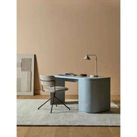 GlobeWest Easton Horizon Desk Lamp with travertine marble base and taupe metal shade on modern desk in minimalistic workspace