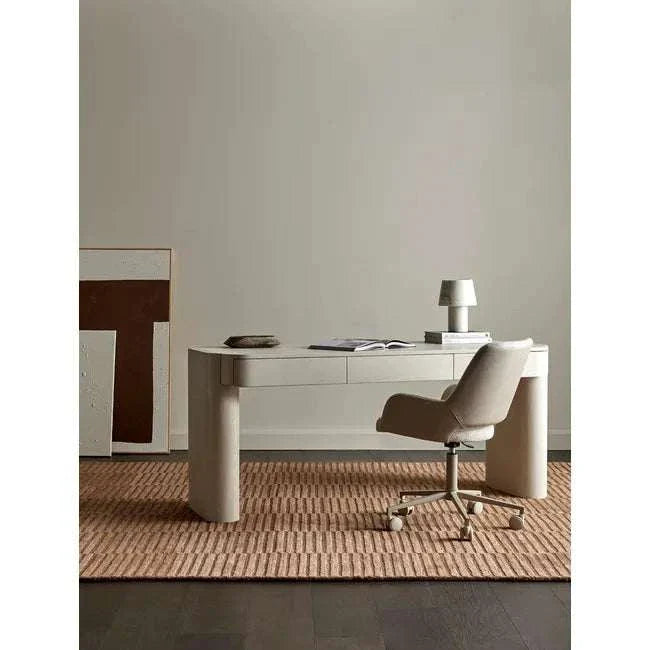 Minimalist Floyd Desk in porcelain finish with three drawers, MDF and ash veneer construction, shown with office chair and lamp on rug in modern workspace