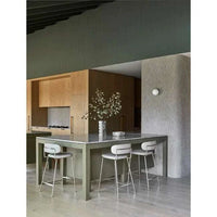 GlobeWest Piccolo Barstool in sandstone PU with brushed chrome frame at kitchen counter
