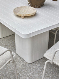 GlobeWest Rufus Dasha Footed Bowl - Travertine, styled in a room setting