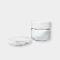 Stackable marble jewellery organiser with removable layers and natural veining, ideal for storing rings and earrings.