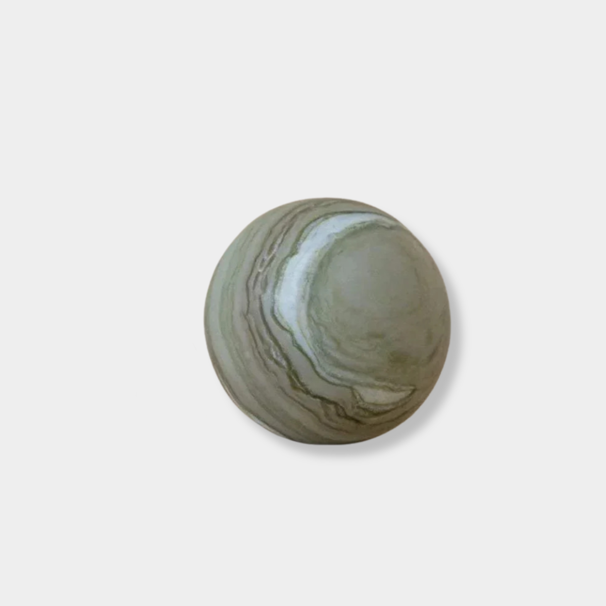 CoTheory Orbit Table Sculpture green marble sphere symbolizing harmony and balance