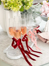 norsu STUDIO Marble Long Tray Calacatta with champagne glasses and ribbon decoration on table