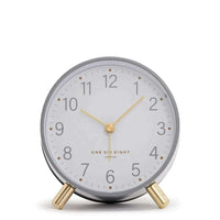 Maisie Silent Tick Alarm Clock in grey with gold accents, vintage design, silent ticking, alarm, and nightlight functions.