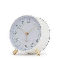 Maisie Silent Tick Alarm Clock in white with gold legs and hands, vintage-inspired design, silent ticking, and built-in nightlight