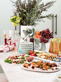 Eden Large Bowl Set pale blue ceramic bowls with beaded rim holding fruit on festive dining table