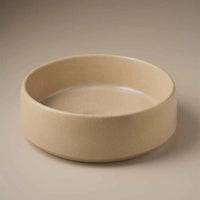 Robert Gordon Kiln 360 round sand hand basin made from high-fired vitrified stoneware, compact bathroom sink.