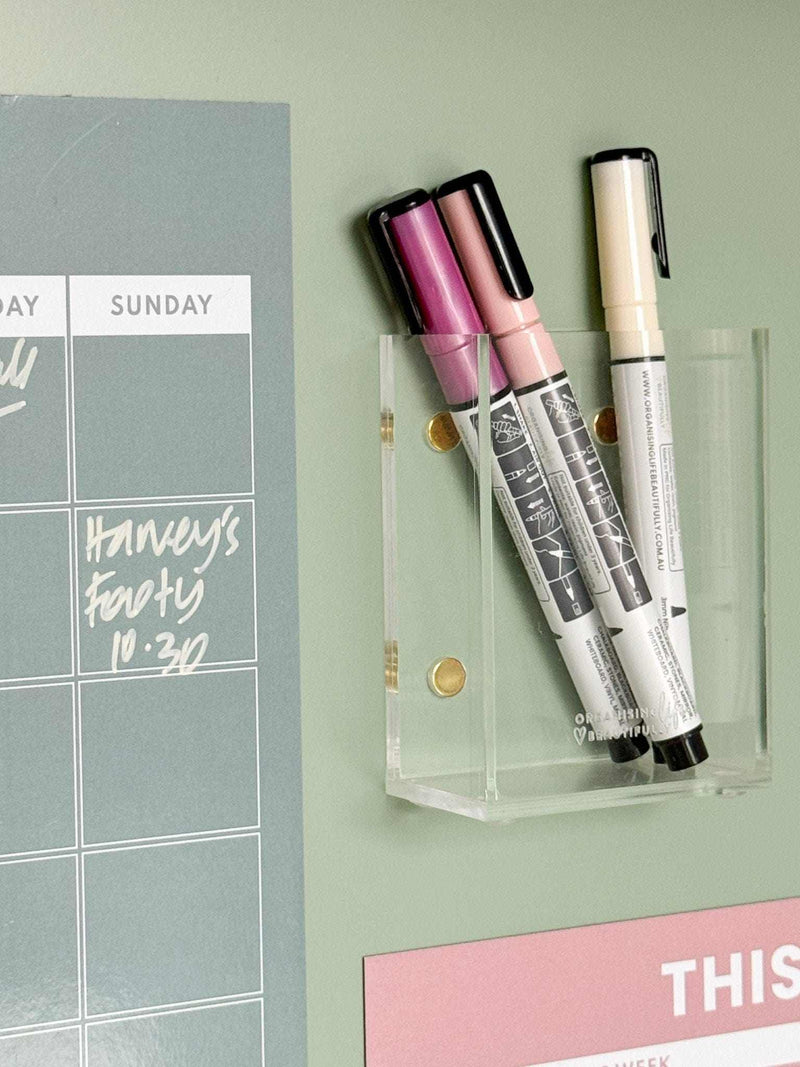 Sky blue magnet meal planner on fridge with markers for weekly menu organization