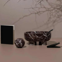 CoTheory Marble Footed oval tray in Rosso Levanto marble with sculptural design and white veining.