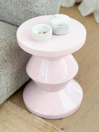 stackable marble jewellery organiser with unique veining in compact cylindrical design on pink pedestal table