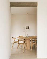 Ethnicraft Bok Dining Chair - Oak, styled in a room setting