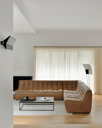 Ethnicraft Sofa N701 Round Corner - Old Saddle, styled in a room setting