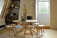 Ethnicraft Oak Mikado Round Dining Table, styled in a room setting