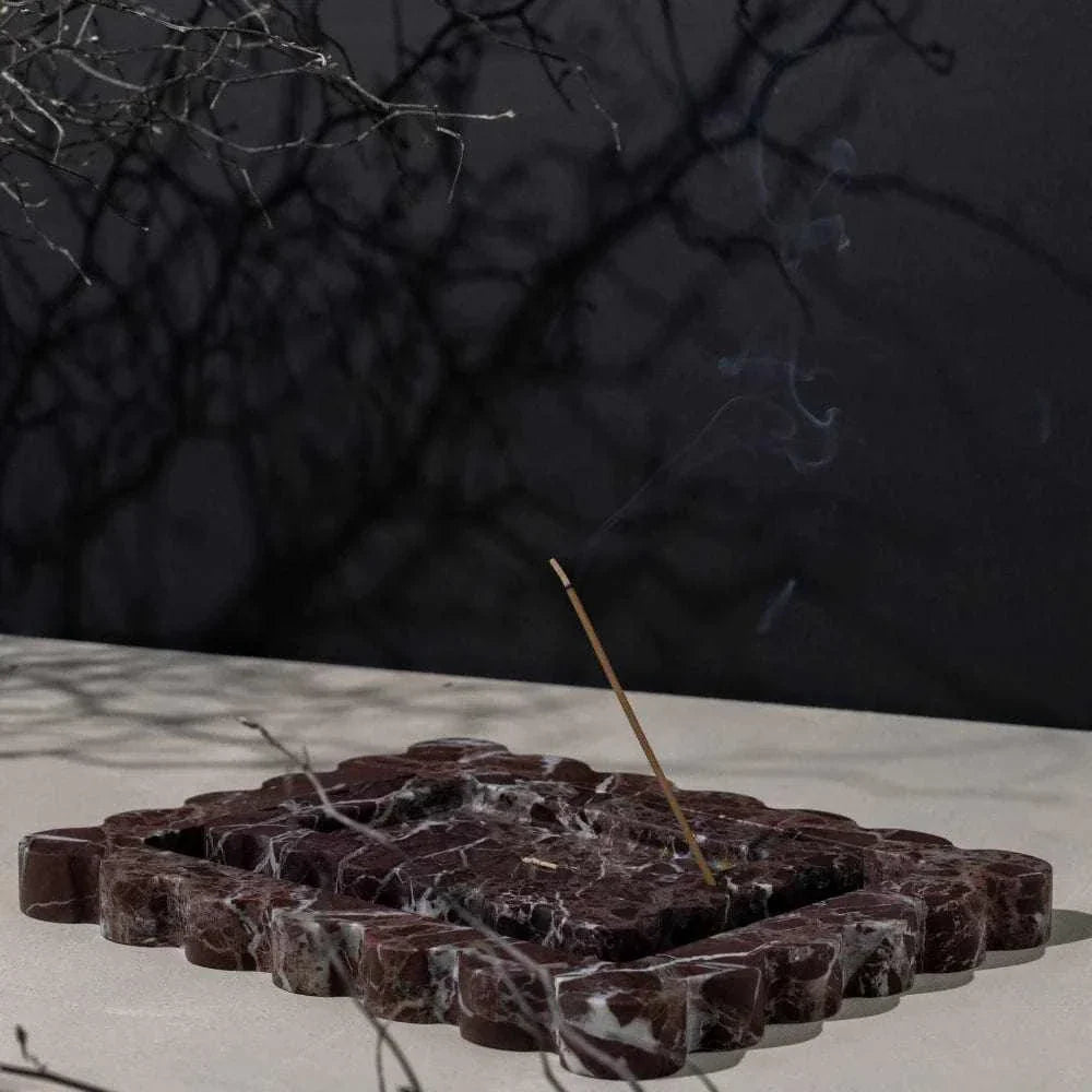 CoTheory Rosso Levanto scalloped marble tray and incense holder with smoke on neutral surface