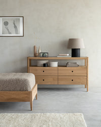 Ethnicraft Oak Spindle Dresser - 4 drawers, styled in a room setting