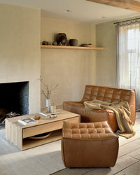 Ethnicraft Sofa N701 Round Corner - Old Saddle, styled in a room setting