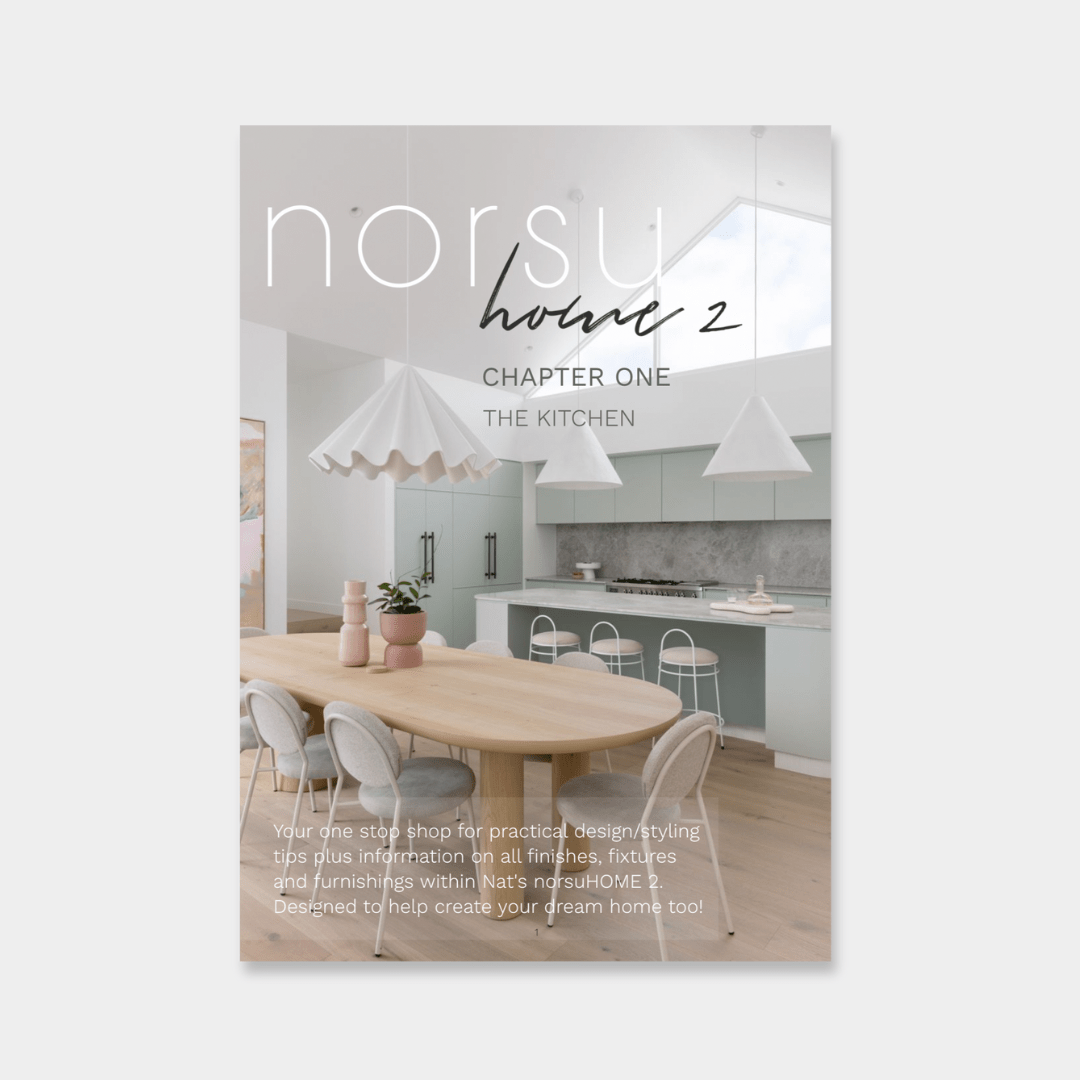 Digital magazine cover featuring a modern kitchen with a wooden dining table, gray chairs, white pendant lights, and minimalist cabinetry.