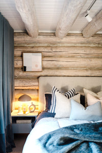Blue bedroom at the norsu cabin styled with duck egg cushions