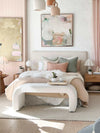 Zaru Boucle Bench seat in oatmeal with curved design at end of bed in a cozy bedroom setting