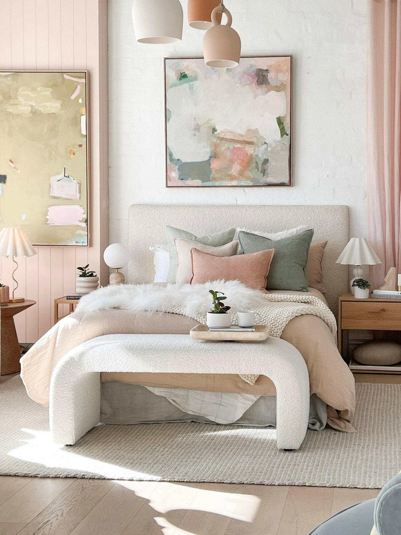 Zaru Boucle Bench seat in oatmeal with curved design at end of bed in a cozy bedroom setting