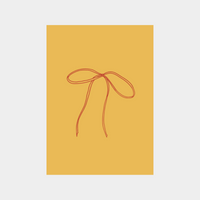 Minimalist digital print of a red ribbon bow on mustard yellow background