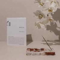 CoTheory small scalloped marble tray and incense holder in brown Calacatta with white orchid and incense stick