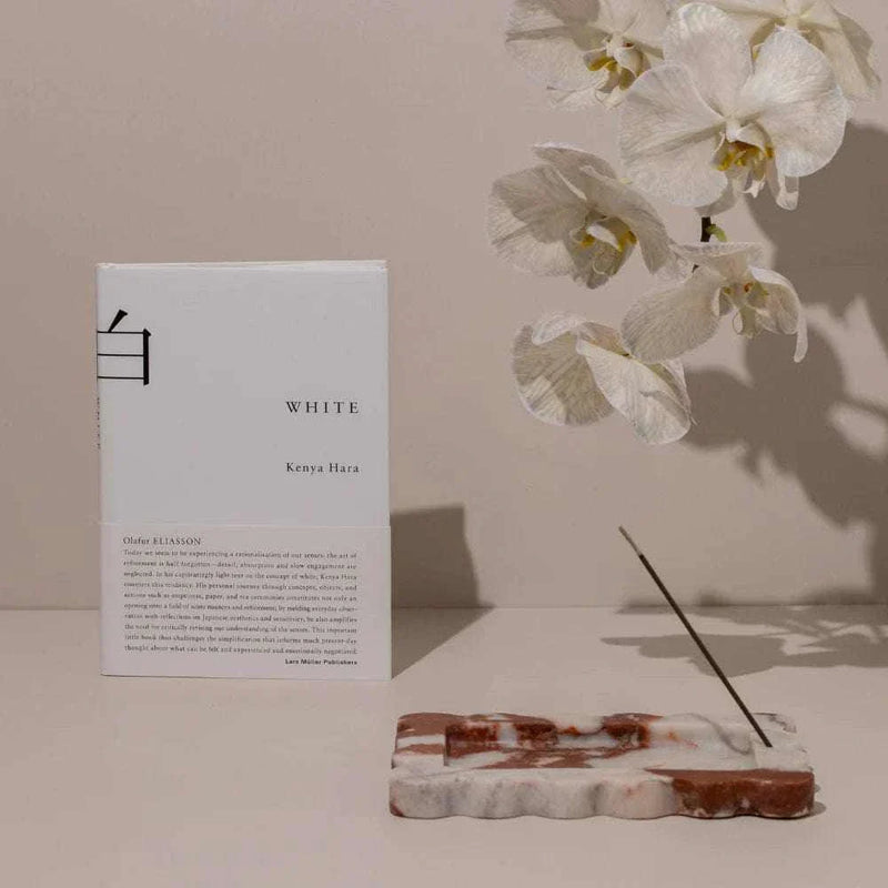CoTheory small scalloped marble tray and incense holder in brown Calacatta with white orchid and incense stick