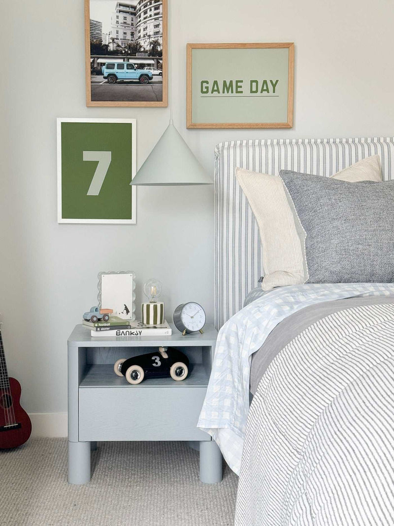 norsu Studio Scalloped Magnetic Photo Frame with blue background on bedside table in modern bedroom setting