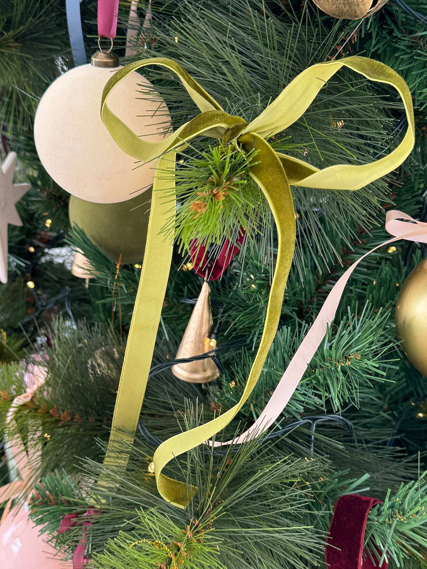 norsu STUDIO Flocked Velvet Christmas Bauble cream with green velvet ribbon on tree