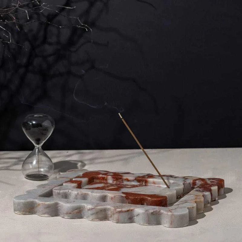 CoTheory Marble Tray Small Scalloped Brown Calacatta Incense Holder with burning incense stick and hourglass on white surface