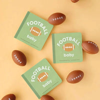 Football Baby board book for toddlers with green cover and football illustration surrounded by small football toys on a beige background