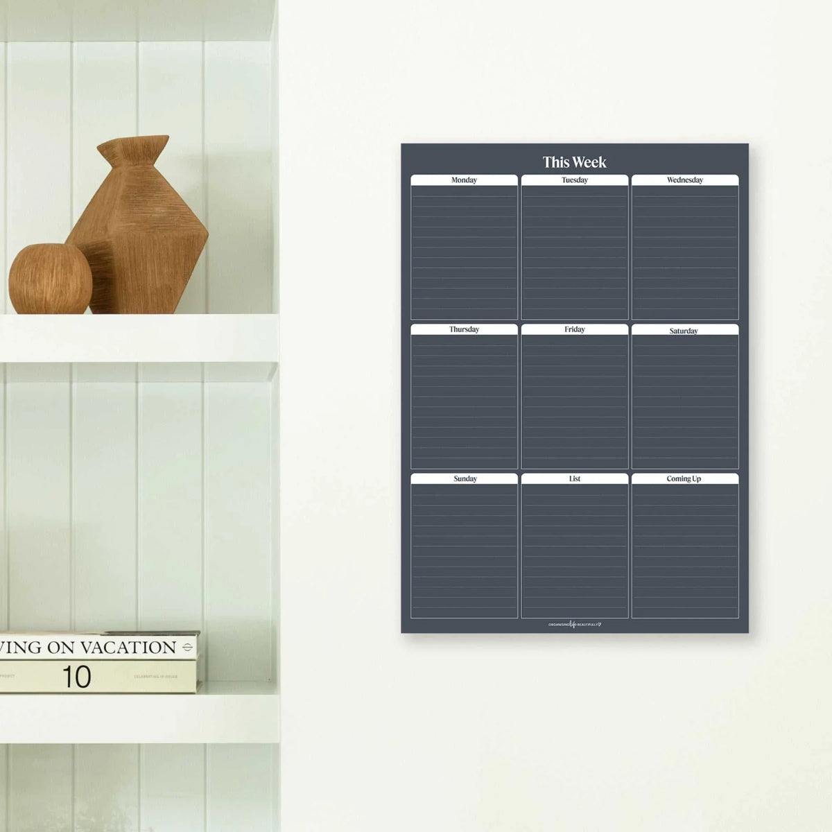 Reusable Peel & Stick Wall Planner by Organising Life Beautifully with white liquid chalk marker and application tool on smooth surface